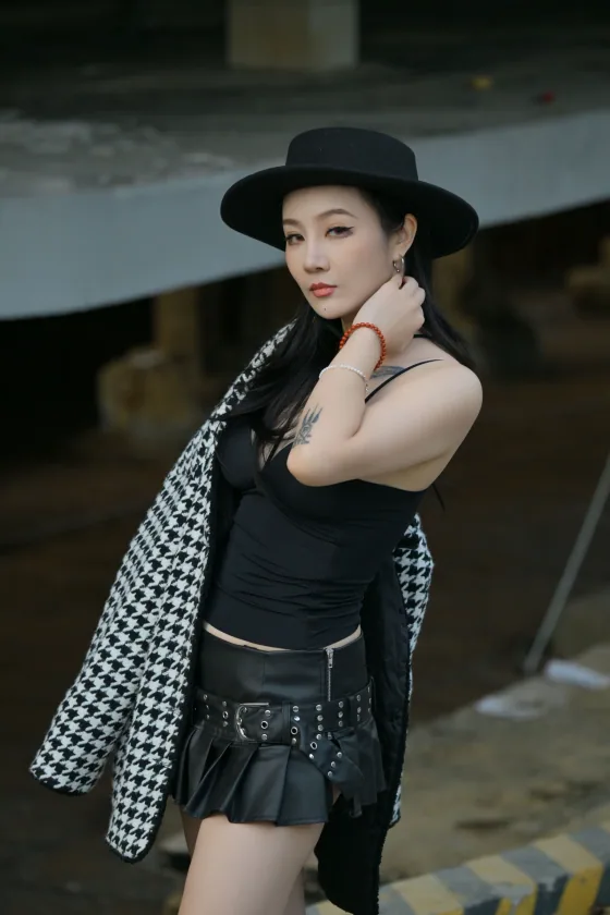 Adult driver portrait with a black hat used in the Flying Roadster AI example